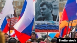 Russia – Russian people carry portraits, banners and flags during a memorial march for Boris Nemtsov to mark the second anniversary of his murder, in Moscow, Russia, 26 February 2017