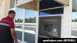 turkmenistan. video grab of a man leaving atm
