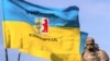 Прапори біля пам’ятника Тарасу Шевченку в Ужгороді під час Маршу національної єдності до Дня захисника України (архівне фото)