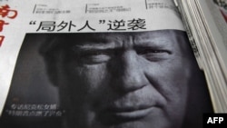 Фотографія Дональда Трампа на обкладинці китайської газети на наступний день після виборів із текстом «Аутсайдер завдає удару у відповідь». Пекін, 10 листопада 2016 року