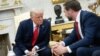 US President Donald Trump talks with US Vice President JD Vance during a meeting with El Salvador's President Nayib Bukele (not pictured) in the Oval Office of the White House in Washington, DC, April 14, 2025.