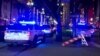 Police attend the scene where a pickup truck drove into a large crowd on Bourbon Street in New Orleans