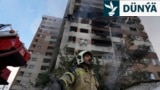 13-nji iýunda Ysraýylyň Eýrana howa hüjümini amala aşyrmagyndan soň, Tähranyň demirgazygyndaky ýaşaýyş jaýda partlamanyň bolan ýerinde işleýän ýangyn söndürijiler.